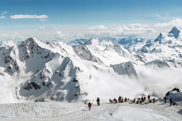 Winter mountains of the Caucasus on a sunny day. Panoramic view - 704524985