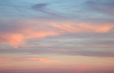 pastel colors from the sunset in the sky without sun with the colorful clouds