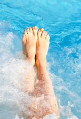 barefoot feet of the young woman during the hydromassage session