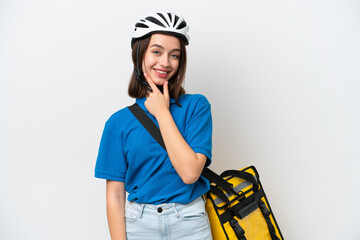 Young Ukrainian woman with thermal backpack isolated on white background smiling