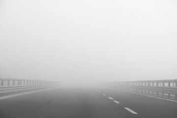 motorway  with a lot of dangerous fog which reduces visibility to motorists