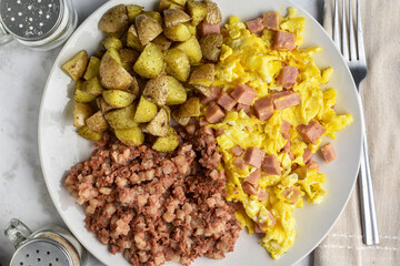 scramble eggs  with diced spam  with corn beef hash