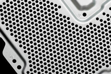 Perforated metal sheet with ventilation holes. Air cooling system of computer technology