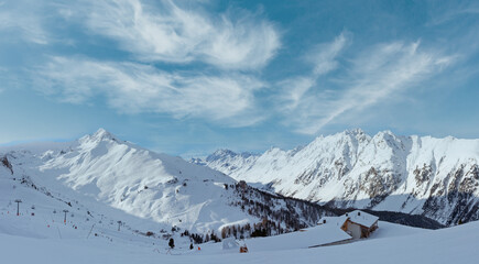 Morning winter Silvretta Alps landscape. Ski resort, Tyrol, Austria. All skiers are unrecognizable.