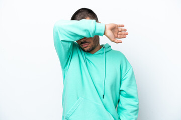 Young caucasian man isolated on white background covering eyes by hands