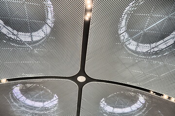 Istanbul airport ceiling with rounded abstract lamps, elegance sophistication. Modern fashionable...