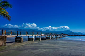 Pier in the morning. Pier in the city of Ubatuba, São Paulo, Brazil, on a sunny day with blue...