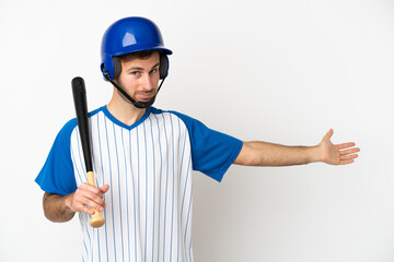 Young caucasian man playing baseball isolated on white background extending hands to the side for inviting to come