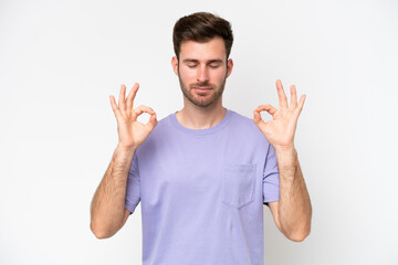 Fototapeta premium Young caucasian man isolated on white background in zen pose