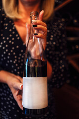 Mock up of large dark glass wine bottle. Empty light sticker.