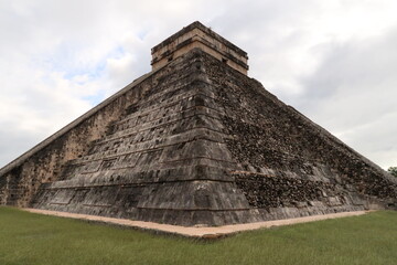 Fototapeta na wymiar Pyramid of Kukulcan, El Castillo, The Castle, at Chichen Itza, one side is restored the other still destroyed, Valladolid, Mexico