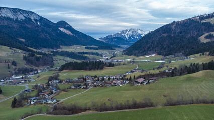 Fototapeta na wymiar Aerial view over small mountain town Itter in Austrian Alps