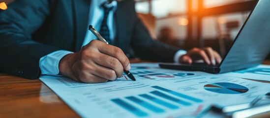 Businessman reviewing financial statement report for business's financial status.