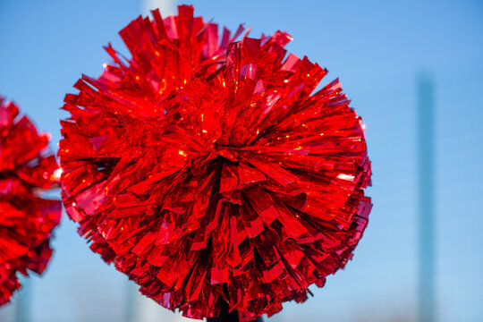 red cheerleader pom poms Cheerleaders with pom poms