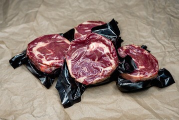fresh beef in vacuum packaging on a background of kraft paper
