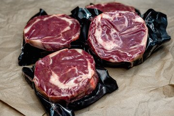 fresh beef in vacuum packaging on a background of kraft paper