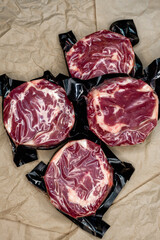 fresh beef in vacuum packaging on a background of kraft paper