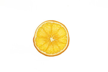 Sliced piece of dry dehydrated orange isolated on white background.