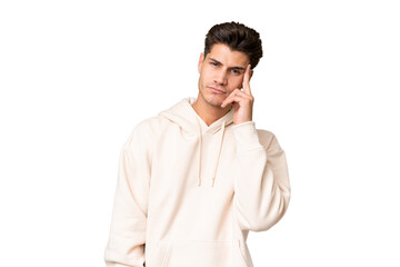 Fototapeta premium Young caucasian handsome man over isolated background thinking an idea