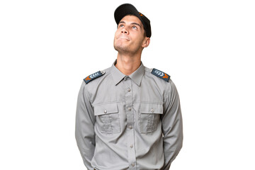 Young security man over isolated background and looking up