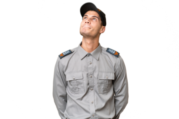 Young security man over isolated background and looking up