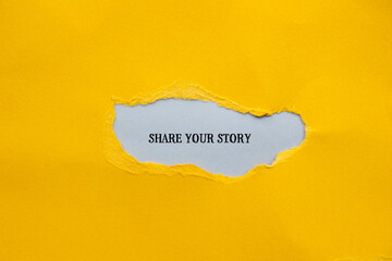 Share your story lettering on ripped yellow paper with gray background. Conceptual photo. Top view,...