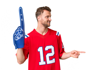 Young caucasian sports fan man over isolated chroma key background pointing to the side to present a product