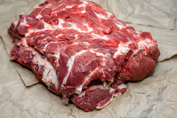 fresh beef in pieces on a background of kraft paper