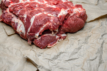 fresh beef in pieces on a background of kraft paper
