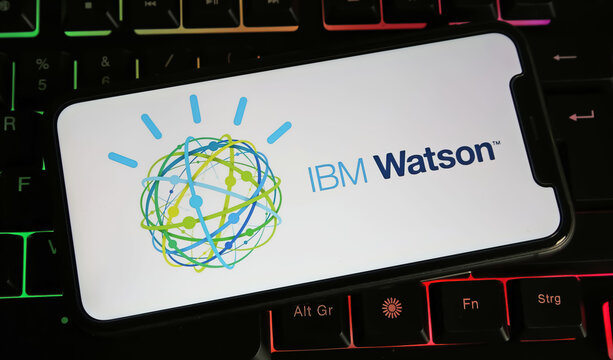 Viersen, Germany - January 4. 2024: Closeup of smartphone with logo lettering of IBM Watson on computer keyboard