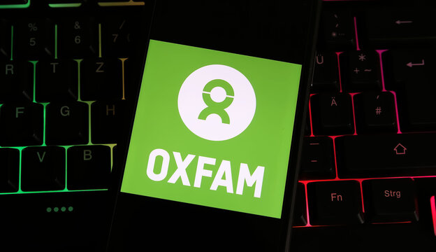 Viersen, Germany - January 4. 2024: Closeup of of smartphone with logo lettering of Oxfam organization