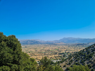 Fototapeta na wymiar Greece island many hills with blue sky and white clouds