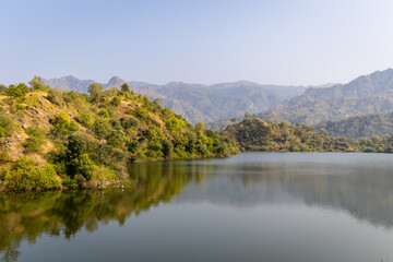 mountain forest with pristine lake reflection at day from different angle