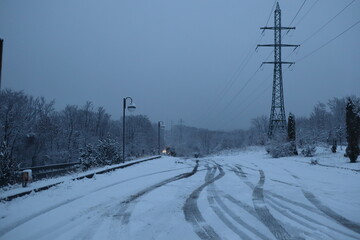 Snowy Road near the forest, winter background