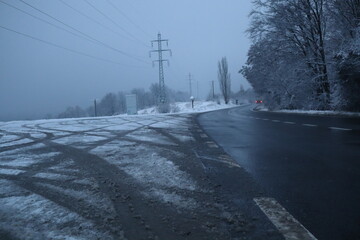Snowy Road near the forest, winter background