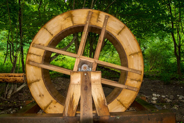 Rotating water wheel in the forest near Muran