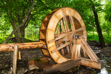 Rotating water wheel in the forest near Muran