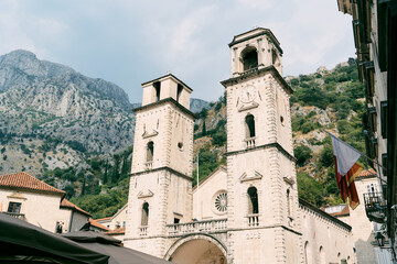 Cathedral of St. Tryphon against the backdrop of green mountains. Kotor, Montenegro