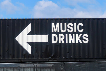 A sign for music and drinks