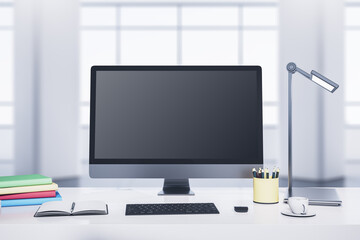 Modern designer desktop with computer monitor, coffee cup, supplies, other objects and window with city view in the background. Mock up, 3D Rendering.
