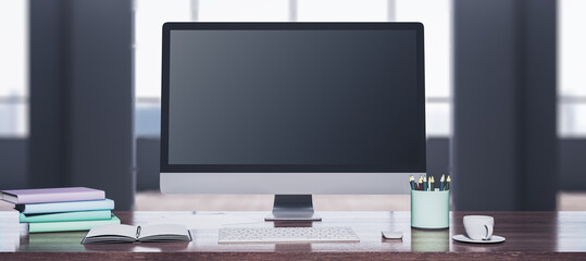 Clean wooden designer desktop with computer monitor, coffee cup, supplies, other objects and window with city view in the background. Mock up, 3D Rendering.