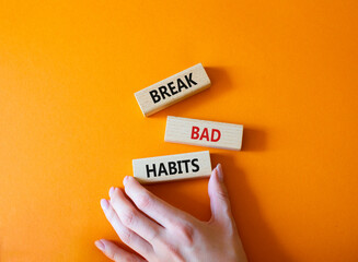 Break bad habits symbol. Concept words Break bad habits on wooden blocks. Beautiful orange...