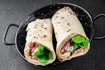 tortilla wrap ham, vegetable, cheese, lettuce delicious fresh tasty healthy eating cooking appetizer meal food snack on the table copy space food