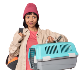 Young Hispanic woman ready for travel with pet carrier showing number two with fingers.