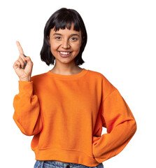 Young Hispanic woman with short black hair in studio showing number one with finger.