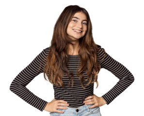 Young Caucasian woman in studio setting confident keeping hands on hips.