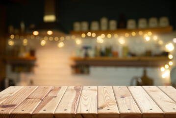 Empty wooden desk on blurred kitchen window for product presentation. High quality photo
