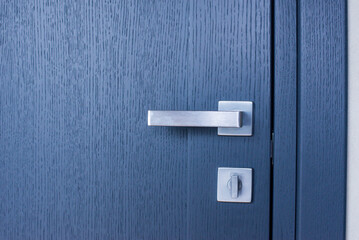 Interior doors are gray. Door handle and lock.