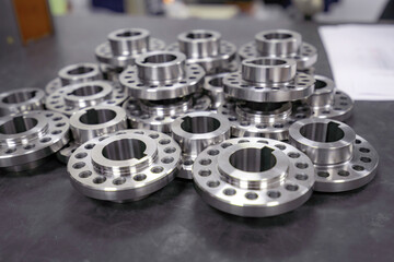 Obraz premium Round parts with holes on the table for sorting and sending for assembly.