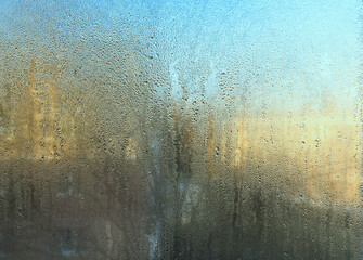 texture background of wet glass. The fogged window.